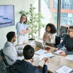 A group of people sitting around a conference table